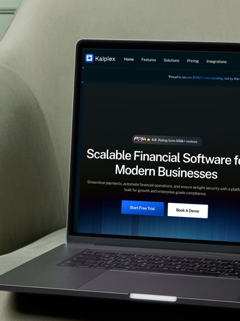 Open laptop on textured beige surface displaying a MacBook Air Mockup website with black keyboard visible.